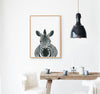Drawing of a Zebra on a white background in a teak frame hanging in a kitchen above a table
