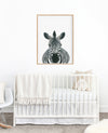 Drawing of a Zebra on a white background in a teak frame hanging in a nursery above a white cot