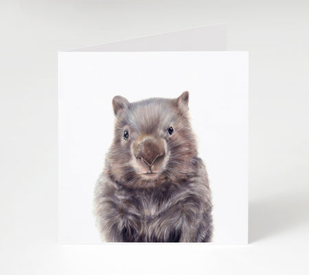 a drawing of a wombat in colour pencil on a blank greeting card