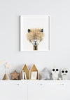 a drawing of a llamas head in a white frame hanging in a boys room above a chest of drawers