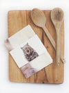 wombat tea towel lying on a timber cutting board