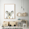 Extra large Koala art print in a timber frame hanging in a kids playroom