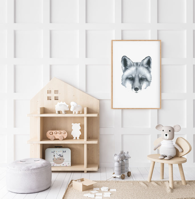 black and white art print of a portrait of a fox in a teak frame hanging on a wall in a children's play room