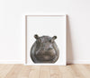 Hippopotamus Print in a white frame sitting on a timber floor