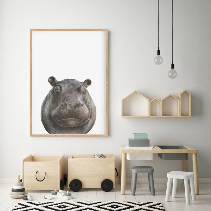 Hippopotamus drawing in a wooden frame hanging in a kids playroom