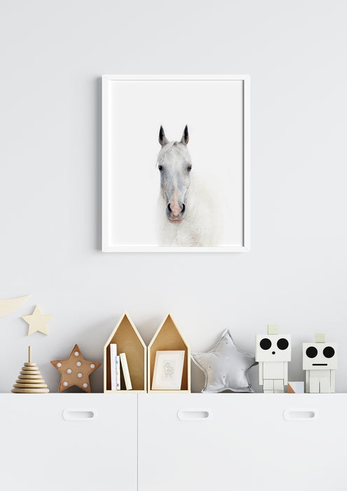 colour pencil drawing of a white horse portrait in a white frame hanging in a kids room above a  dresser