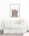 colour pencil drawing of a tiger on a white background in a teak frame hanging above a cot in a nursery
