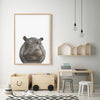 Drawing of a Hippopotamus on a white background in a teak frame hanging in akids playroom