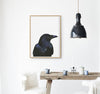 Black Bird Art Print hanging in a kitchen above a rustic timber table- the wild woods