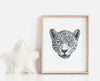 black and white drawing of a leopards portrait in a timber frame next to a white star pillow in a childrens room