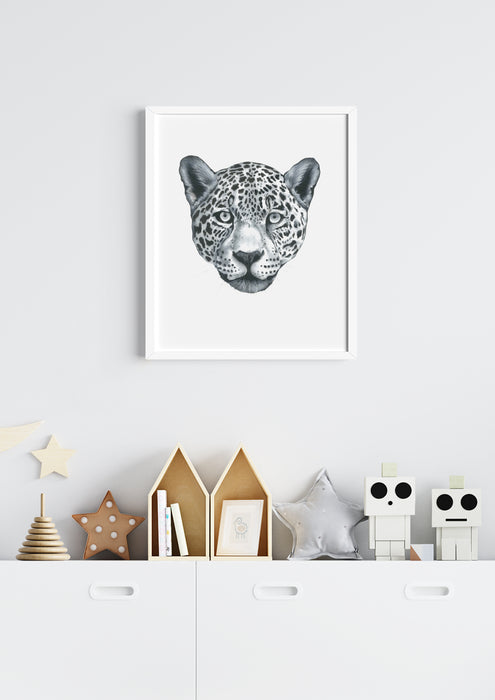 black and white drawing of a leopard portrait hanging in a childrens room above a cabinet