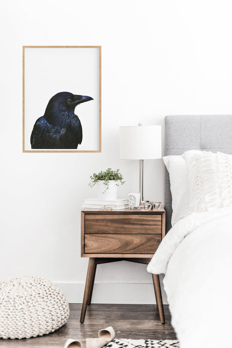 Black Bird Art Print hanging in a bedroom above a side table - the wild woods