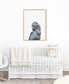 Black Cockatoo Art Print hanging in nursery above a white cot - the wild woods