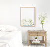 mother polar bear and baby in a wooden frame hanging above a side table in a bedroom