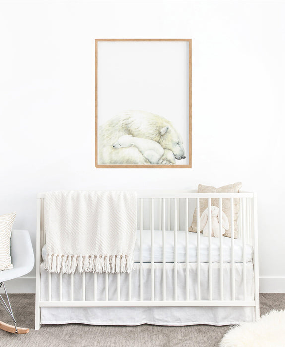 art print of a mother polar bear and a baby  hanging in a nursery above a white cot