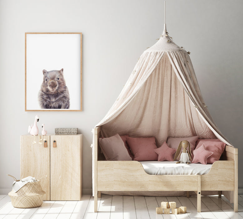 an art print of a wombat hanging in a girls bedroom 